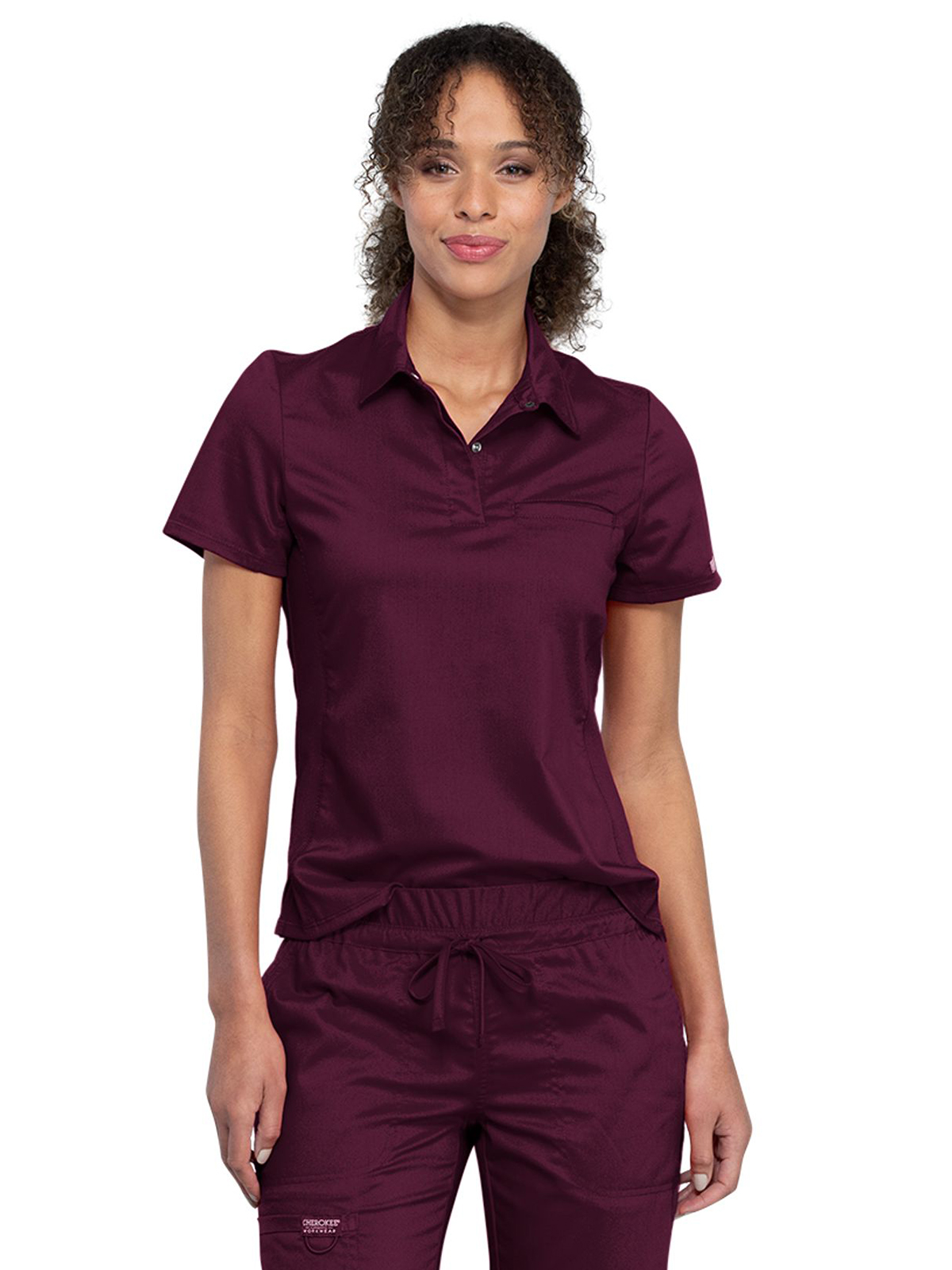 Cherokee - Workwear Revolution - Women's 1-Pocket Tuckable Snap Front Polo Shirt