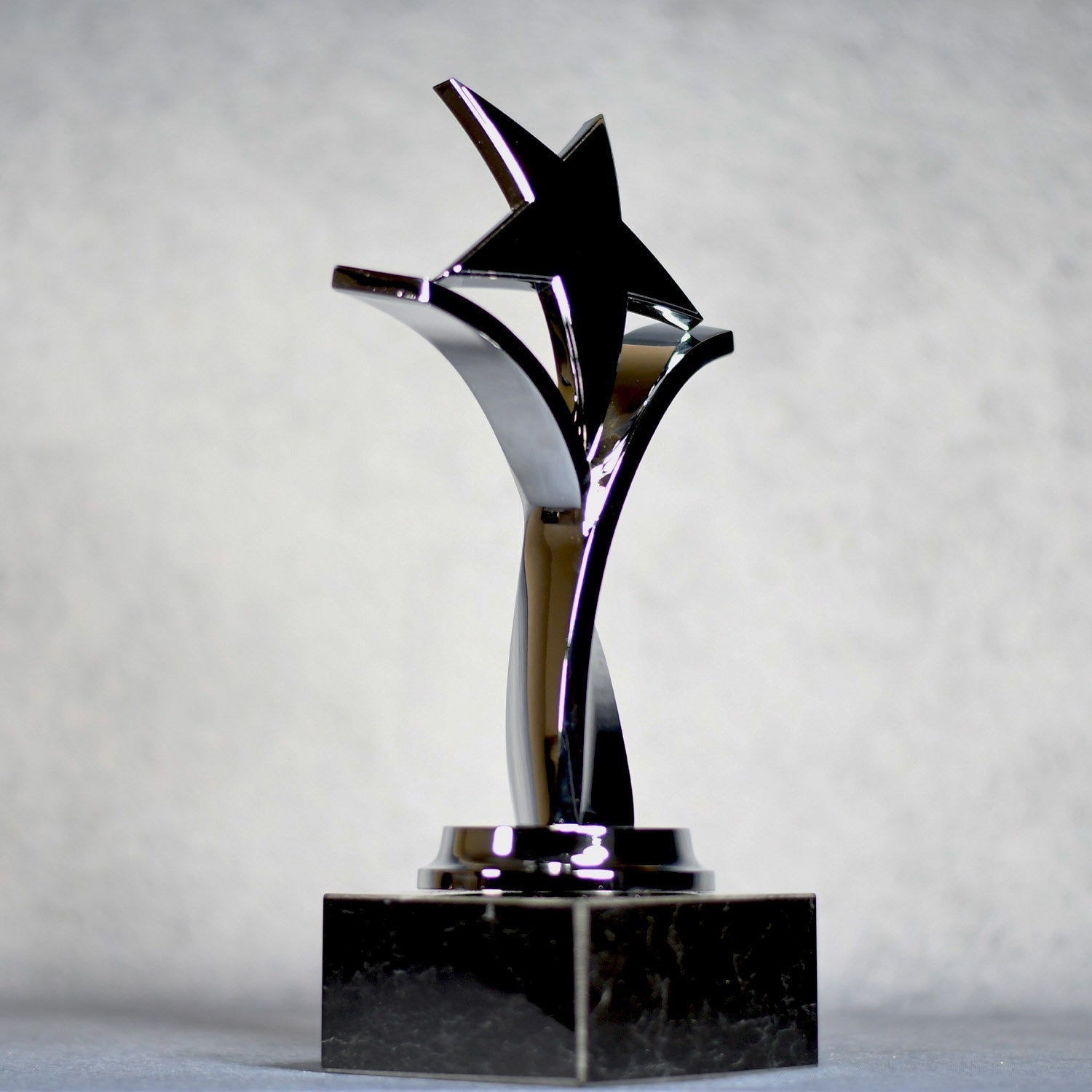 Twisting Star On Black Marble Base 2