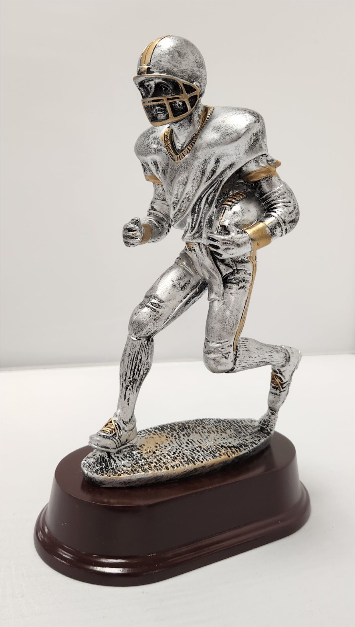 Male Running Football Figure 2