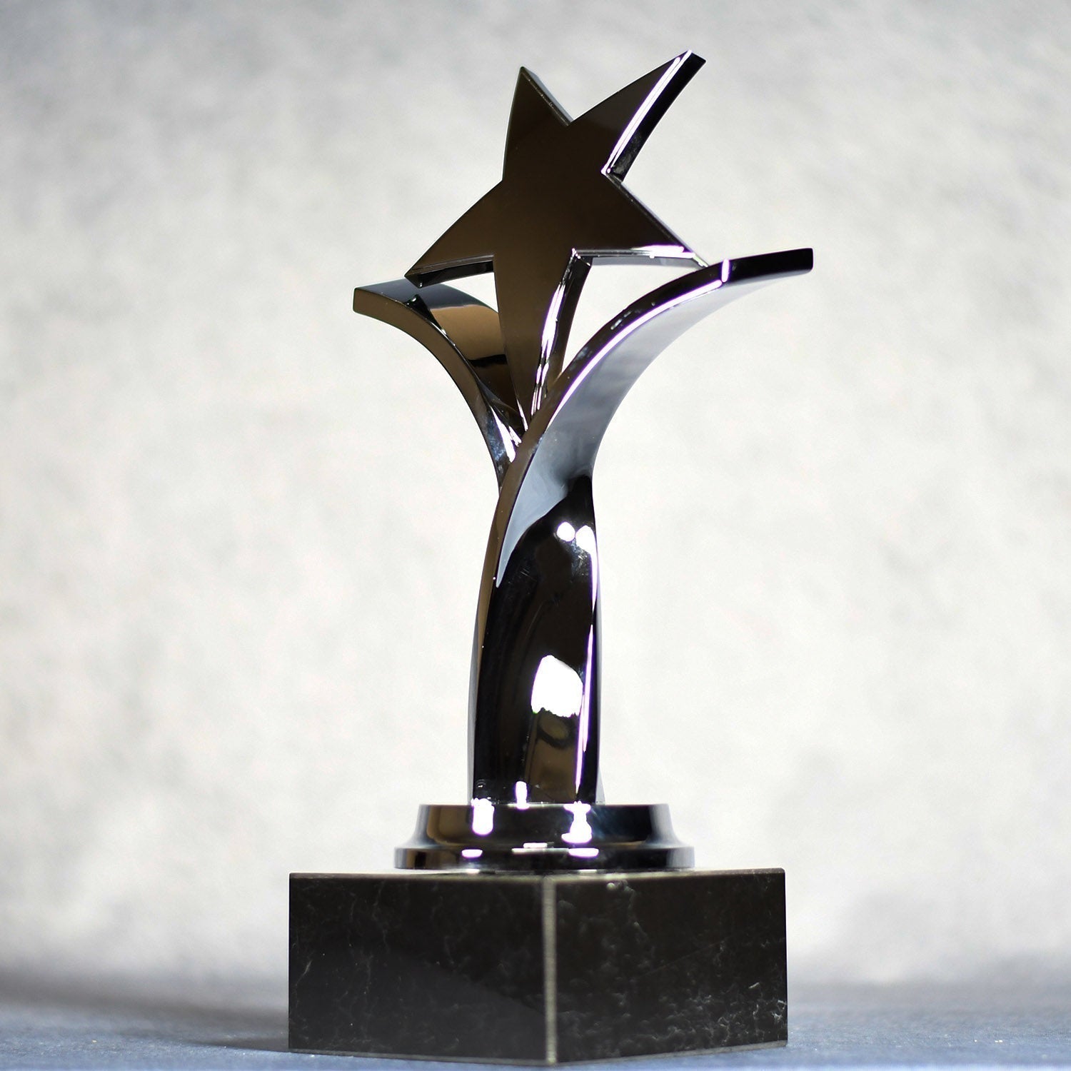 Twisting Star On Black Marble Base 6