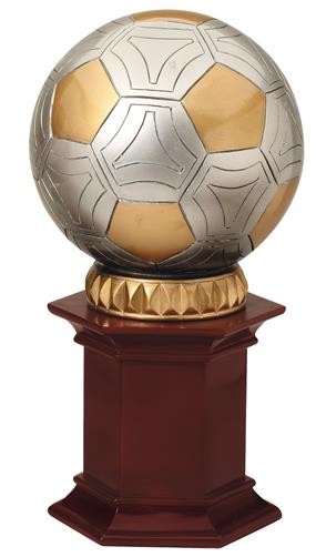 Soccer Ball resting on a rosewood stained resin pedestal. 2