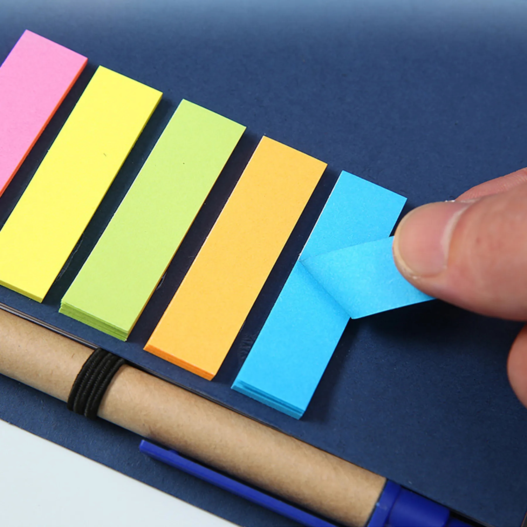Brown paper notebook with pen and post-it notes 4