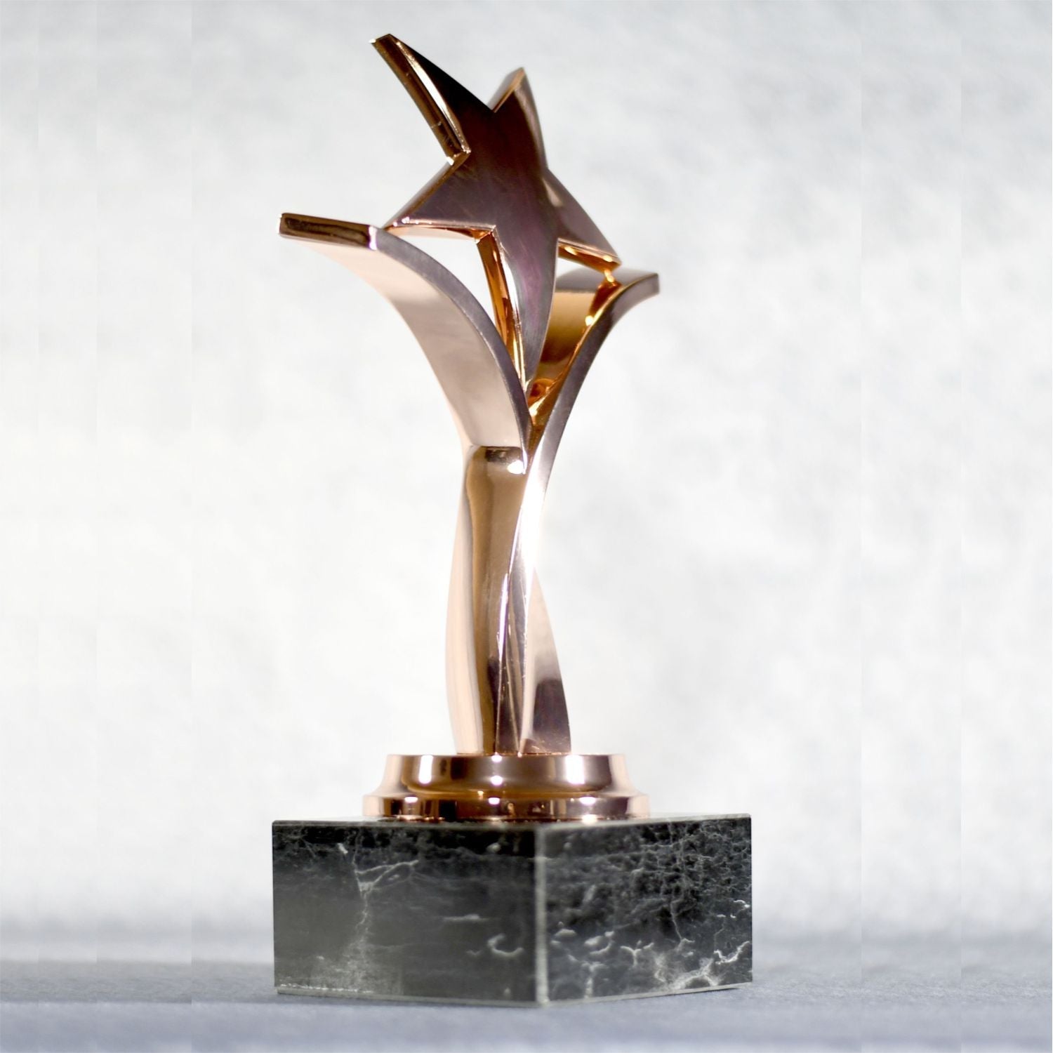 Twisting Star On Black Marble Base 8