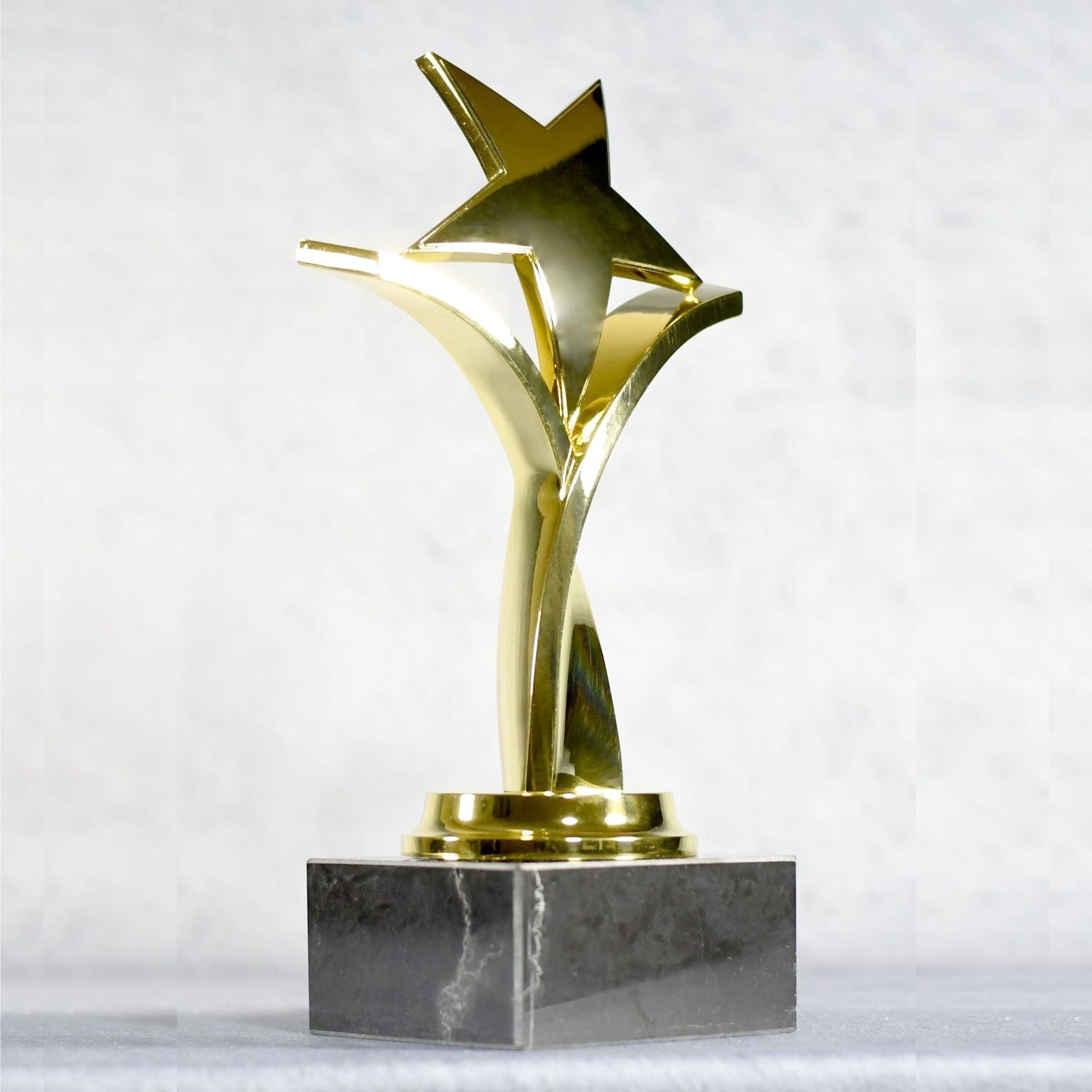 Twisting Star On Black Marble Base 7