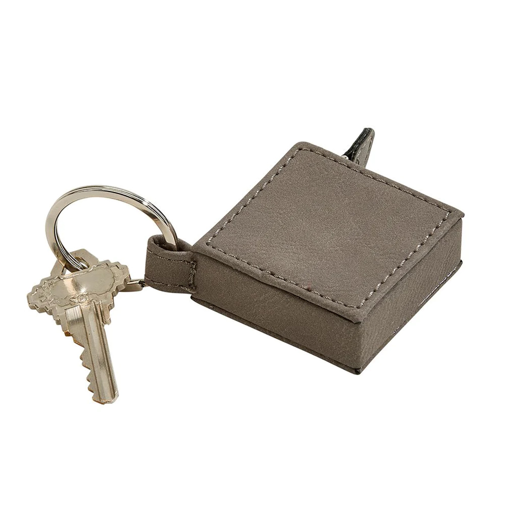 leatherette sq 5" tape measure key chain. 1