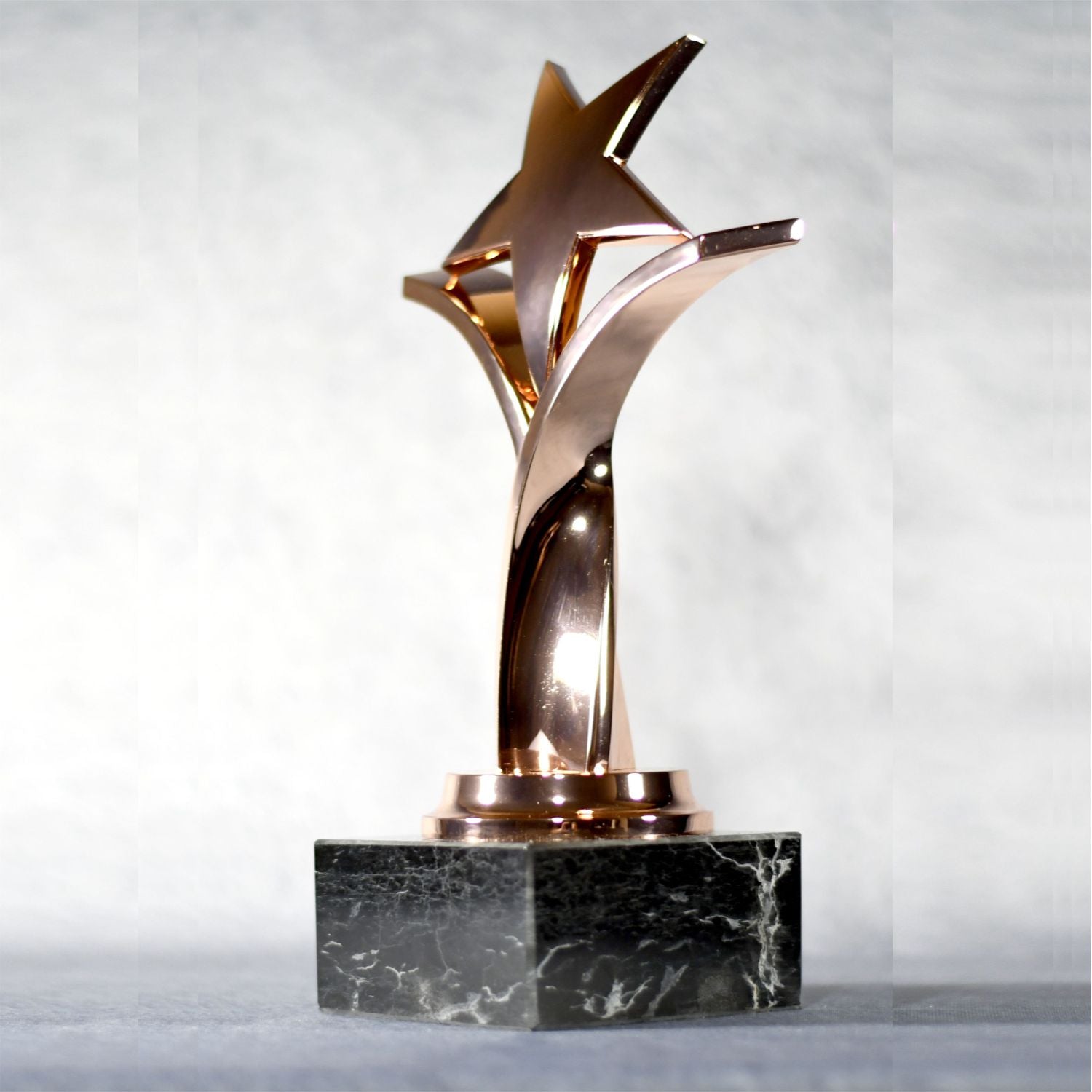 Twisting Star On Black Marble Base 4