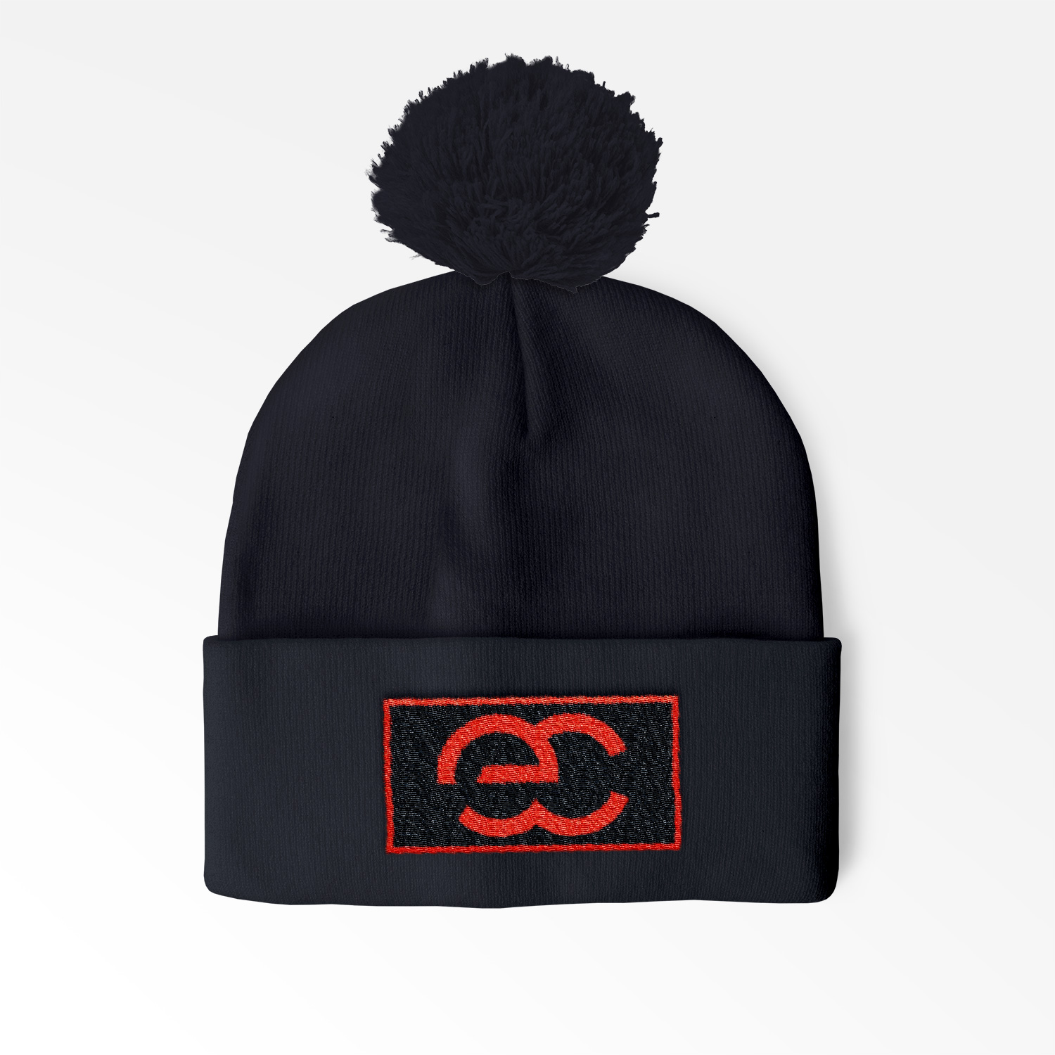 Cuffed Pom Beanie with sewn on embroidered patch