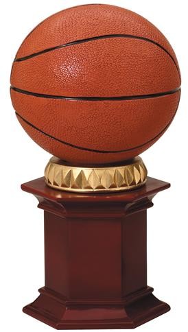 Basketball resting on a rosewood stained resin pedestal. 1