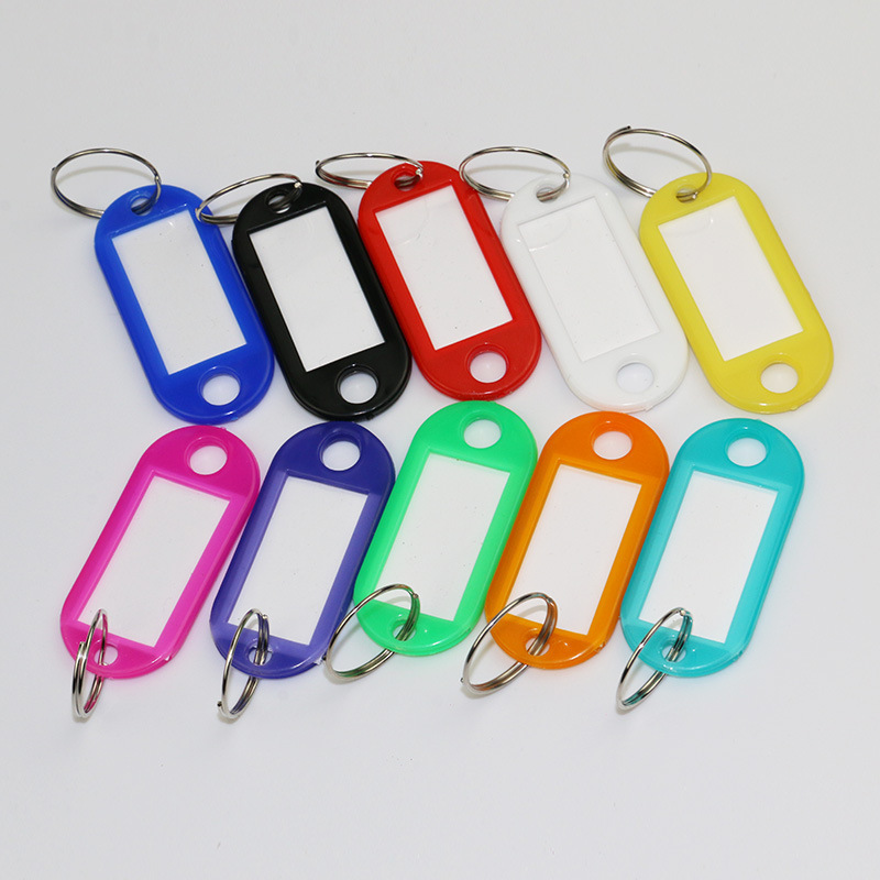 Plastic key tags with write-on inserts attached to metal key holders 2